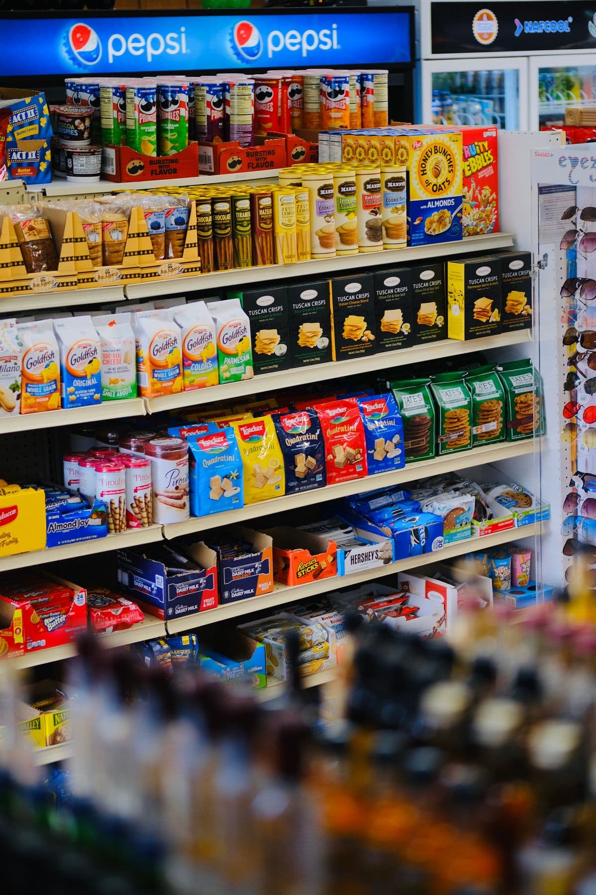 Retail shelves stocked with a diverse portfolio of packaged food and snack products